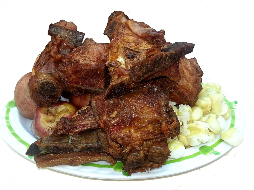 Chicharrón de Chancho acompañado con su papa y mote