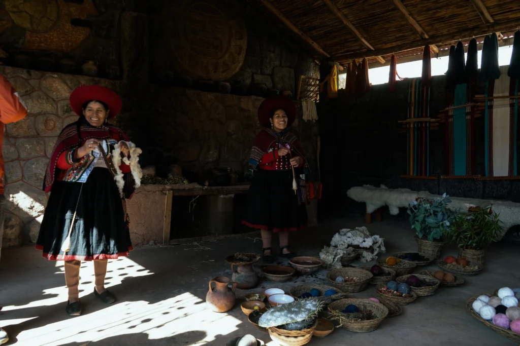 Artisan women showcasing different types of cotton threads dyed with various plants