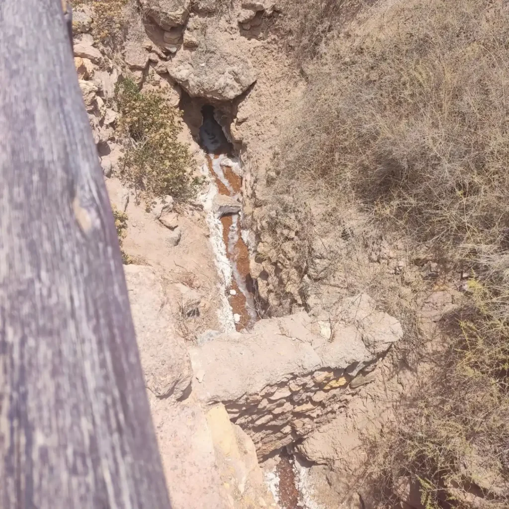 Underground stream flowing towards the pools of the Maras Salt Mines