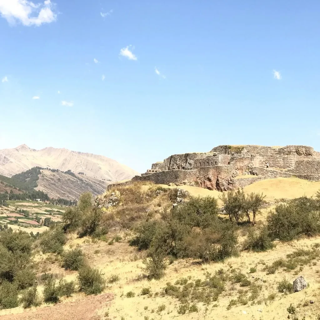 First level of the Puca Pucara Archaeological Complex, surrounded by stone walls.