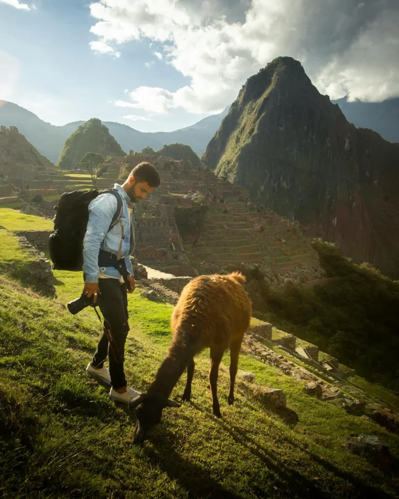 Tourist in Machu Picchu ready with photography equipment