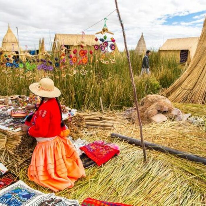 Floating Islands on Lake Titicaca Puno, Peru, South America, thatched home. Dense root that plants Khili interweave form natural layer about one to two meters thick that support islands